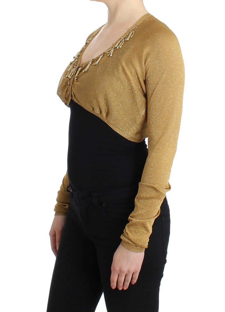 Goldfarbener Shrug mit Verzierungen