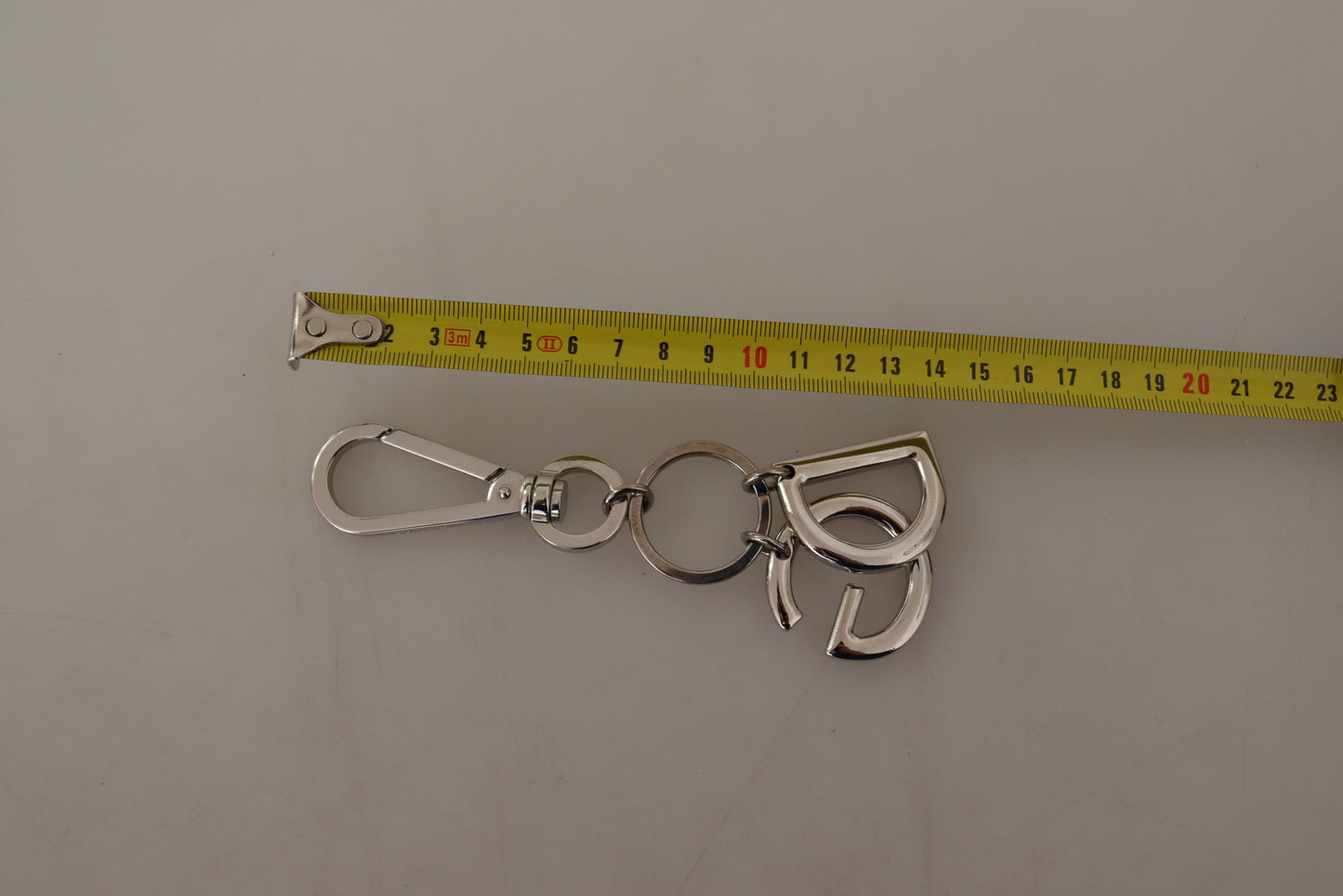 Silberfarbener Messing-Schlüsselanhänger DG Logo Keychain