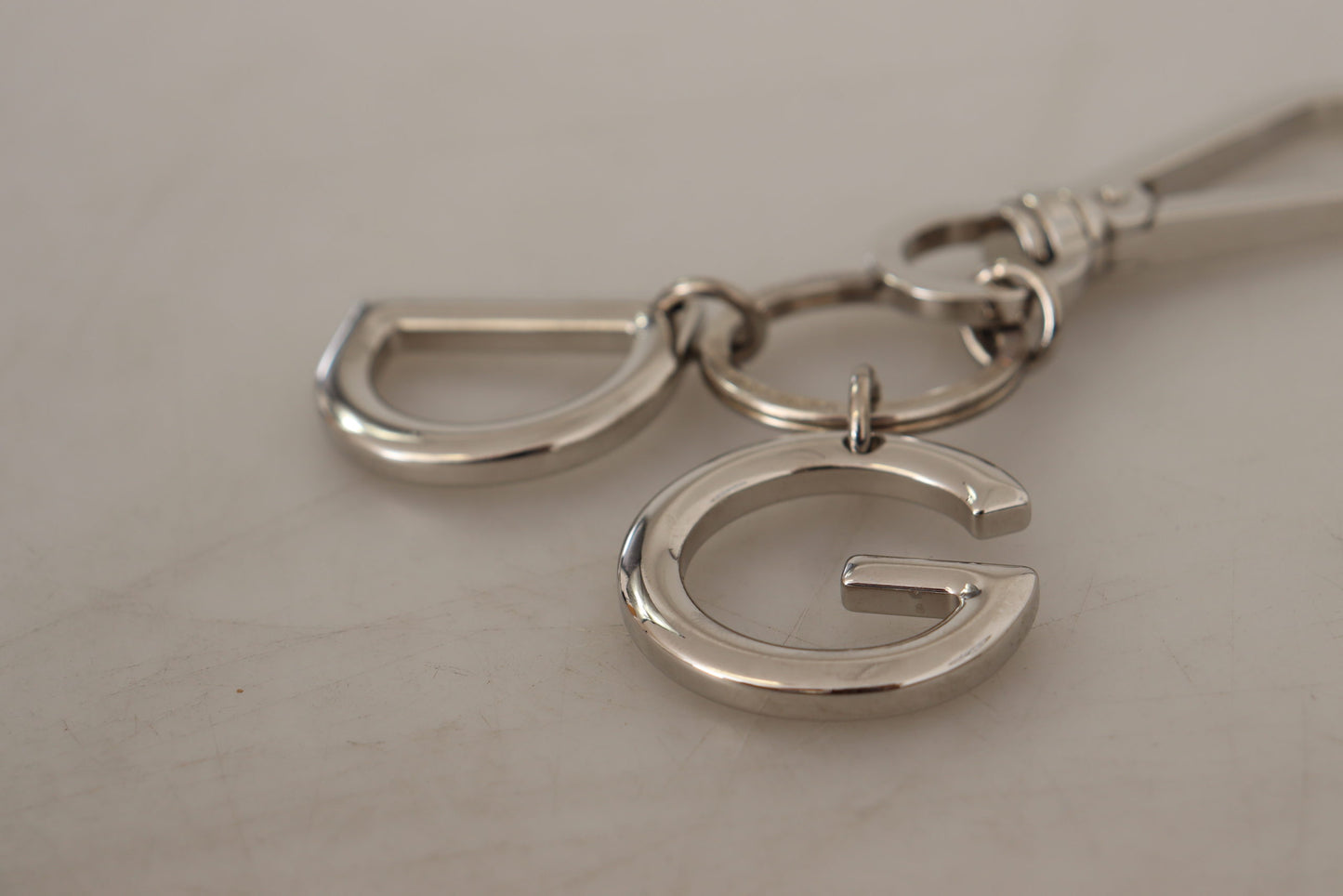 Silberfarbener Messing-Schlüsselanhänger DG Logo Keychain