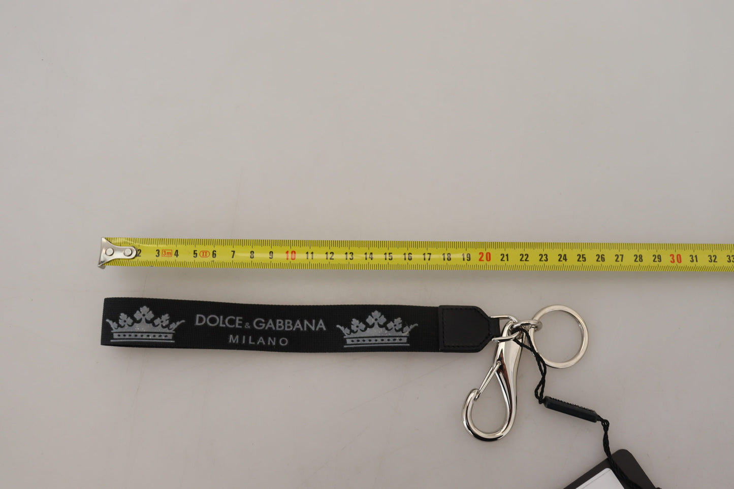 Schwarzer Polyester Logo Silberton Messing Schlüsselanhänger