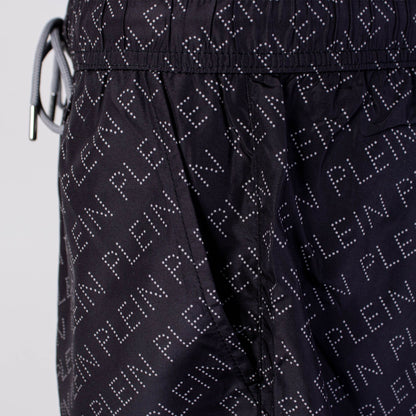 Bedruckte schwarze Boxer-Badeshorts