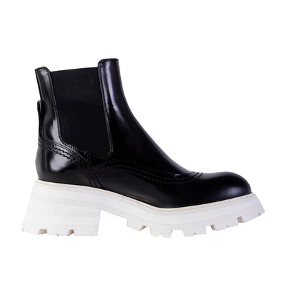 Chelsea-Stiefel aus schwarzem Leder mit weißer Sohle